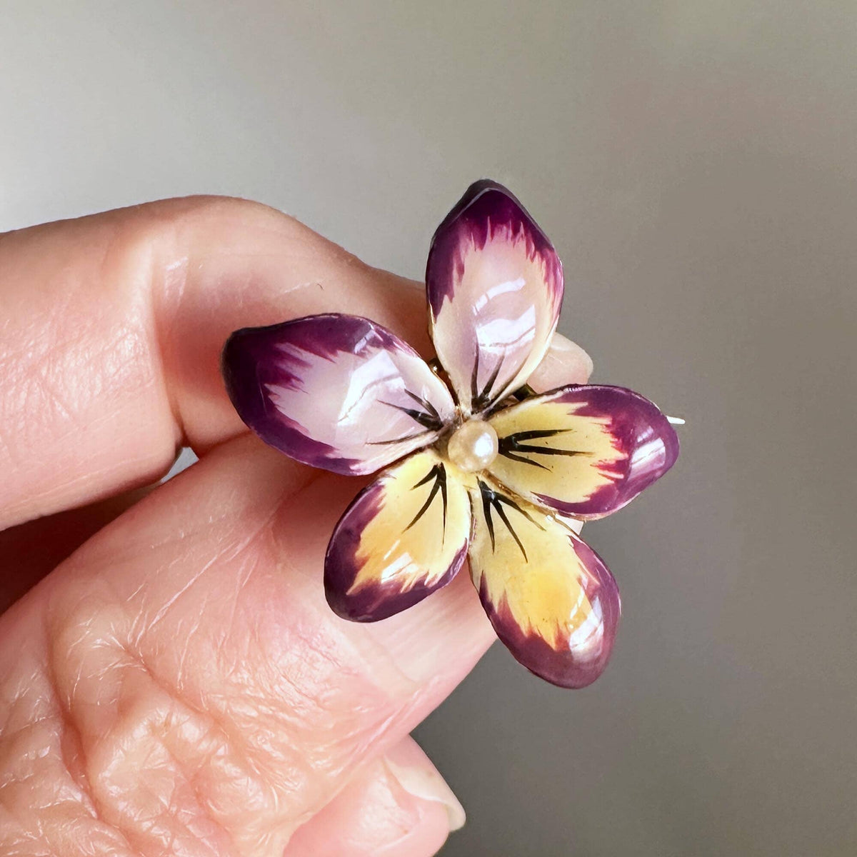 Lot - JEWELRY: Two 14K Gold Pins: a yellow gold Art Nouveau pansy pin,  purple enameled pansy with one old European cut diamond in center,  (approximately 0.03 ct). 7/8 x 5/8, diamond