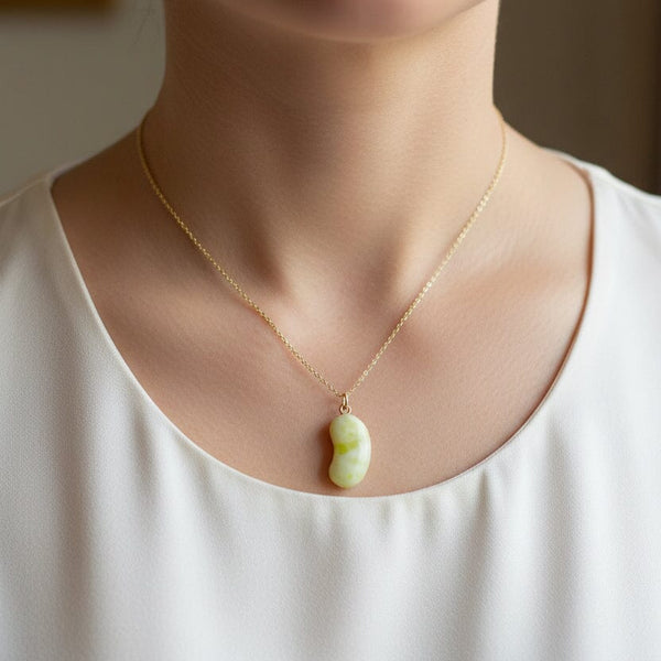 Vintage 9K Gold Carved Iona Marble Bean Charm Pendant