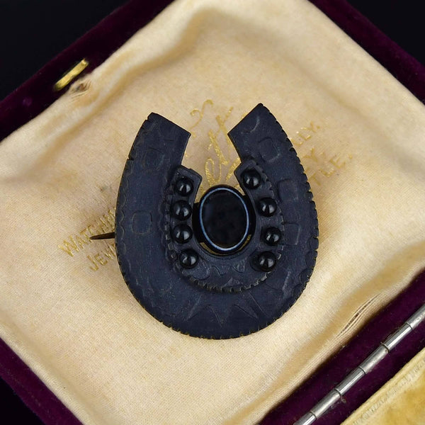 Antique Vulcanite Bullseye Agate Horseshoe Brooch