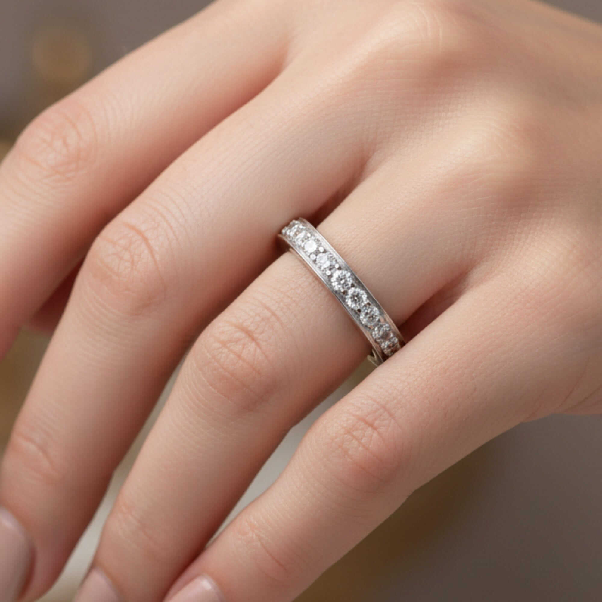 Mid-century platinum diamond eternity band worn on the hand