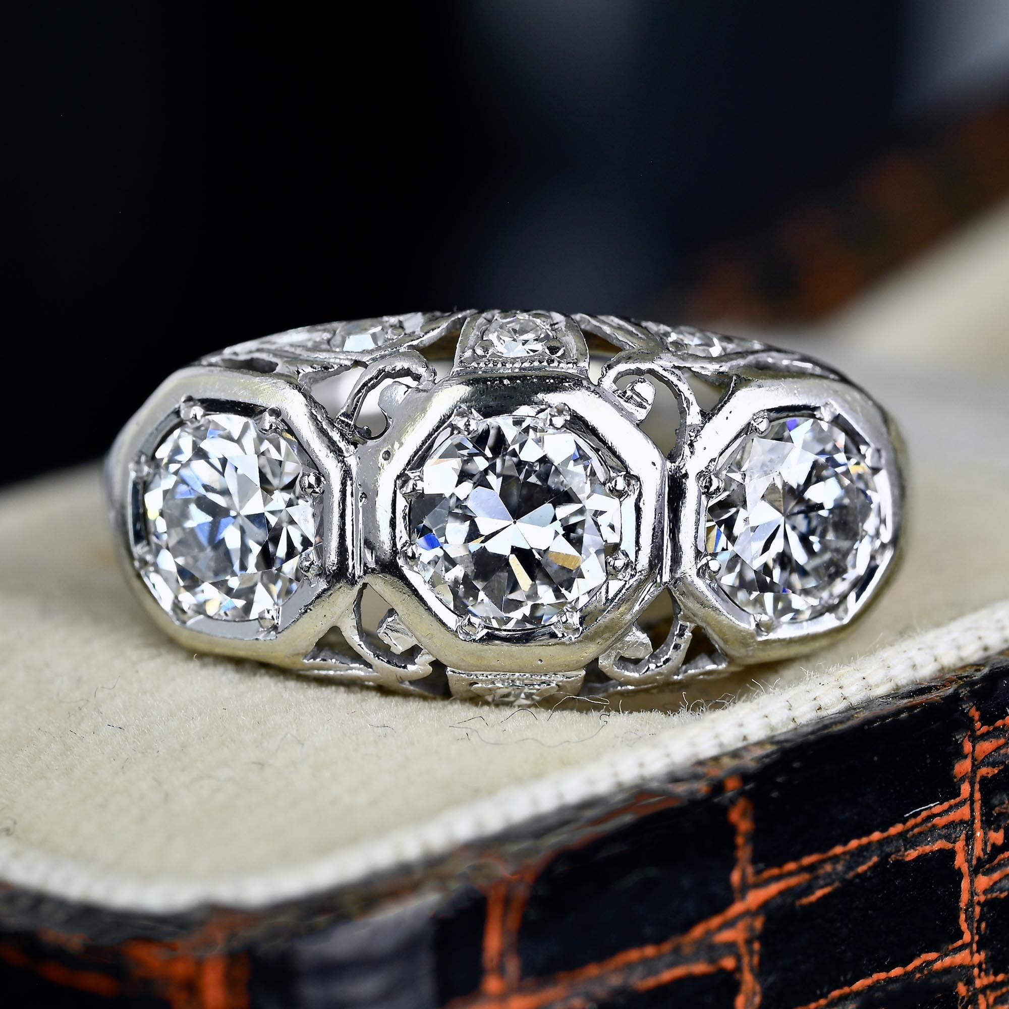Art Deco platinum three-stone diamond ring with European-cut diamonds in octagonal frames
