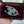 Load and play video in Gallery viewer, Antique Edwardian Connemara Marble Shamrock Wishbone Brooch
