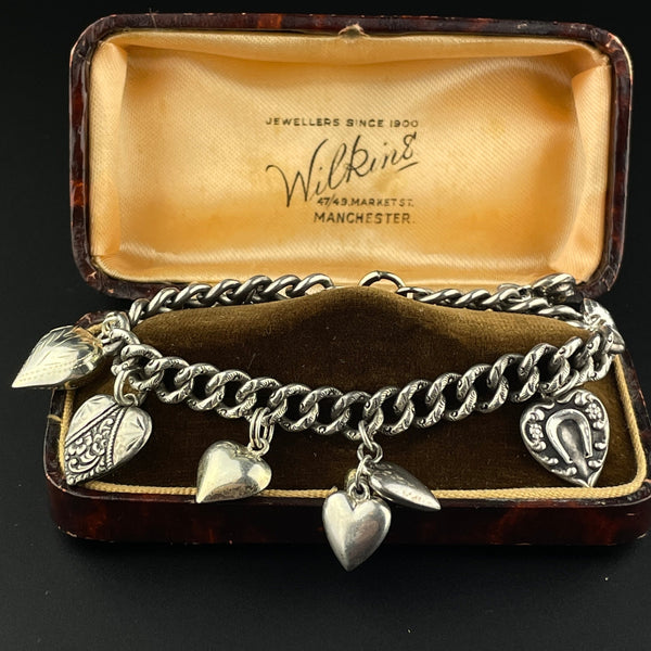 Lot - Antique charm bracelet with various Jewish charms and Hebrew  inscriptions. Figural and religious forms. Bracelet measures 7.5in length.  Charms each about 1 to 1.5in length.