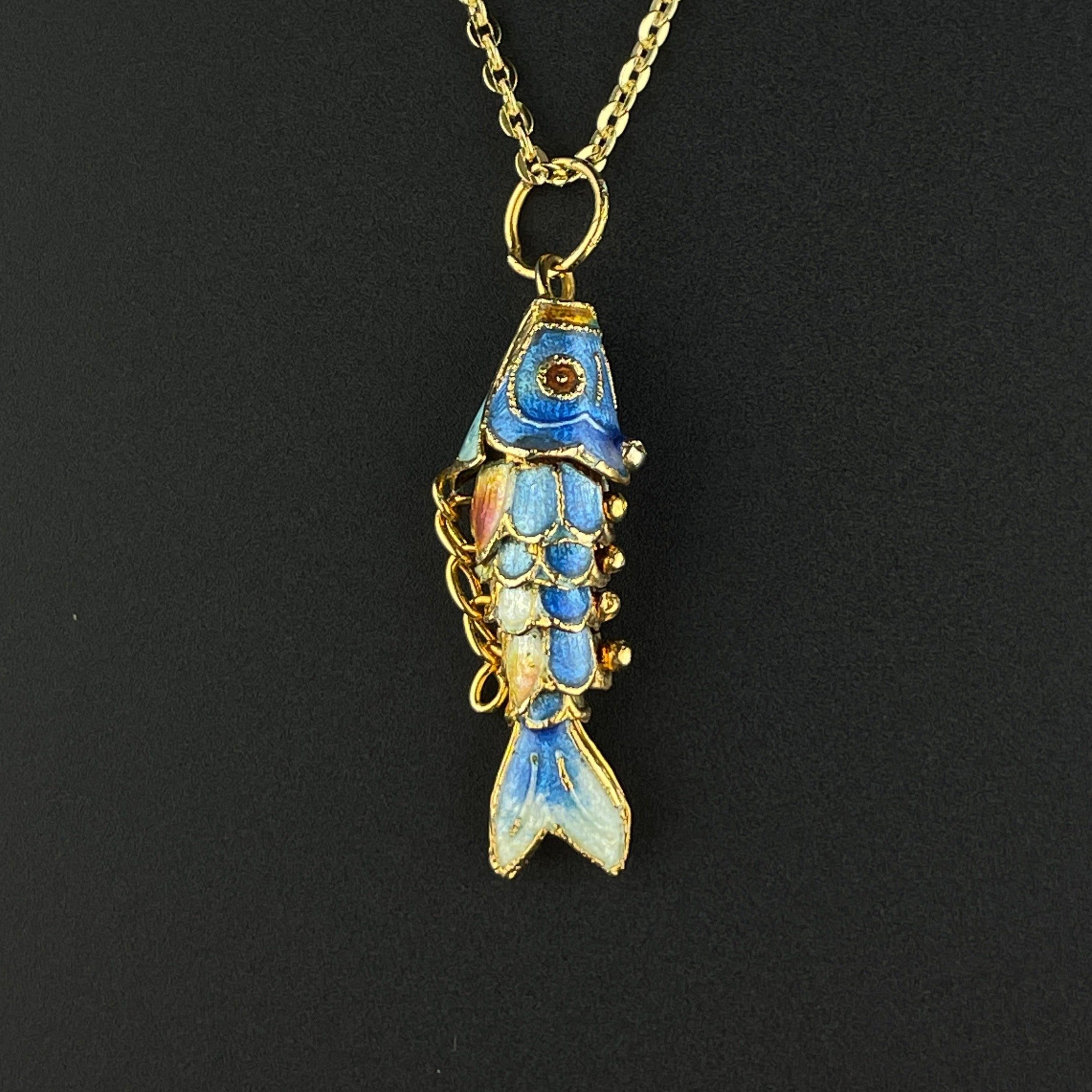 Articulated fish clearance pendant meaning